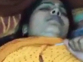 Watch the seductive Sari in a yellow sari in this XNXX video