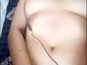 A cute girl pleasuring herself with her fingers