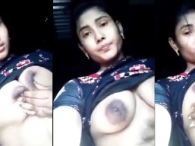 Pretty girl flaunts her large breasts in a seductive manner