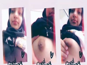 A sweet hijabi babe flaunts her huge breasts on camera