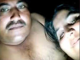 A mature couple in the countryside at night
