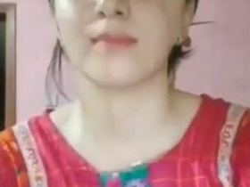 A stunning woman displays her assets