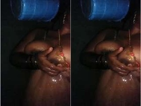 Indian wife enjoying a bath in the tub