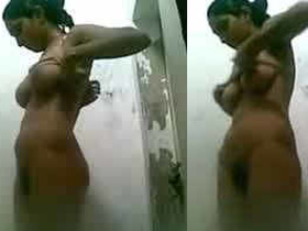 Naked desi girl in the bathroom showing off her natural breasts
