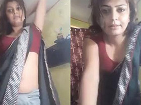 Curvy aunti Puja in saree and boobs, showing off her navel cleavage