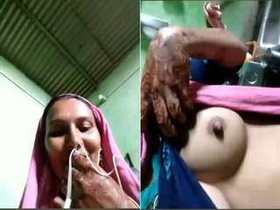 Exclusive video of bhabhi revealing her breasts and intimate area