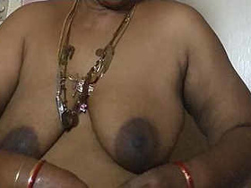 Boob-obsessed Tamil aunty Madurai flaunts her big tits at age