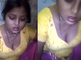 A stunning woman enjoys chapathi while showing off her ample cleavage