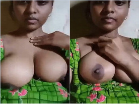 A beautiful Indian girl pleasures herself with her breasts and fingers