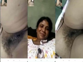 Mature Desi woman flaunts her wet pussy and gives a sloppy handjob