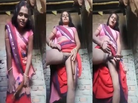 A desperate Indian bhabhi masturbates with a dildo in front of the camera for selfies