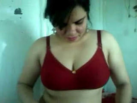Radha Bhabhi's seductive performance in a red bra and skirt