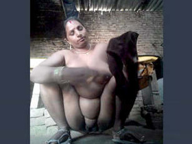 Bhabhi from a village flaunts her big boobs and pussy