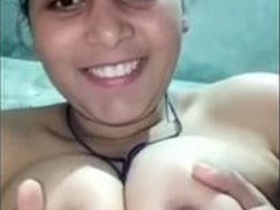 Desi bhabi flaunts her big boobs and pussy in solo video