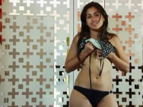 A pretty Indian girl plays with her nice body, showing off her cute facial expressions