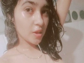 Naked Indian teen girl takes a bathroom selfie