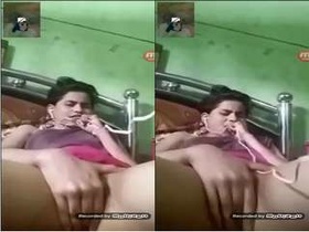 Exclusive video of a hot Indian girl pleasuring herself with her fingers
