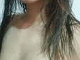 Stunning girl reveals her naked body in a seductive striptease