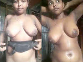 A village girl flaunts her breasts and masturbates