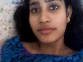 Smiling babe licks her boobs and pussy in hot video