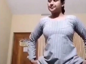 Desi bhabi flaunts her sexy curves in a revealing dress