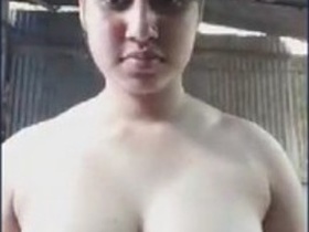 A stunning village woman flaunts her ample bosom