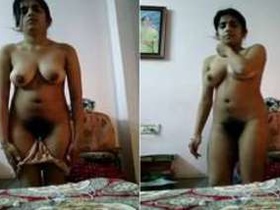 Desi Indian girl strips and masturbates on camera