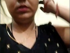 Attractive sister flaunts her breasts in a seductive manner