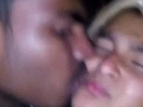 Young couple shares a passionate kiss in an amateur video