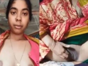 Indian girl flaunts her big tits and shaved pussy in steamy video