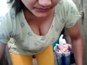 Horny aunty shows off her big boobs while doing laundry