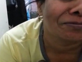Aunty gives a blowjob while talking to her lover
