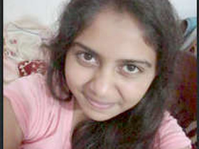 A cute Indian girl records a video for her boyfriend