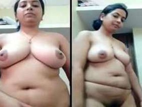 Indian woman removes sari and lingerie to reveal her XXX-rated breasts