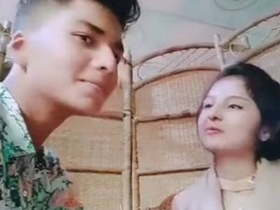 Outdoor romance: Cute couple shares kisses and caresses at restaurant