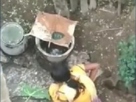 Young woman relieves herself in the great outdoors