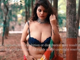 Stunning model poses seductively with large breasts during photo shoot
